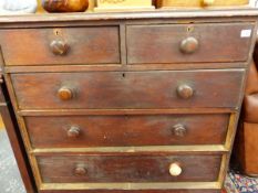 A LATE VICTORIAN PINE CHEST OF DRAWERS.