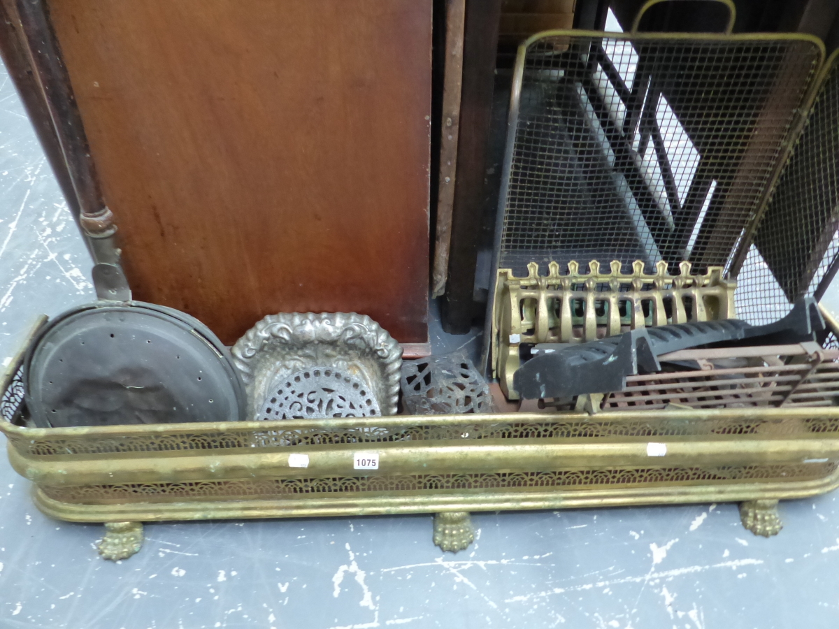 A VICTORIAN BRASS FIRE FENDER, A SPARK GUARD, WARMING PAN, FIRE FRONTS, CRUMB SCOOP, TRIVETS.