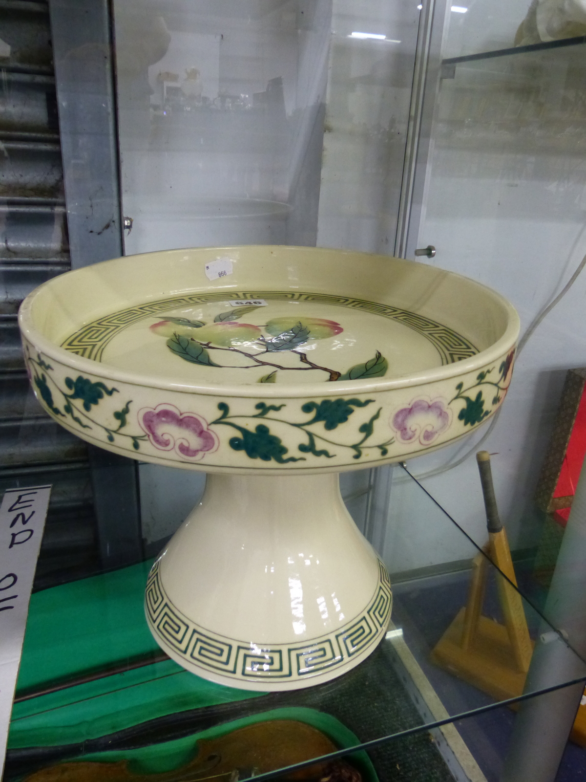 A CHINESE TRUMPET FOOTED SHALLOW BOWL DECORATED WITH PEACHES