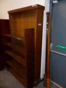AN OAK OPEN BOOKCASE, A STAINED PINE BOOKCASE AND TWO WOODEN CURTAIN POLES