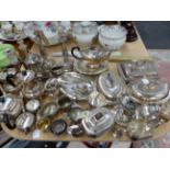 A COLLECTION OF ELECTROPLATE TEA WARES, CANDLESTICKS AND VEGETABLE TUREENS