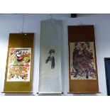 THREE CHINESE SCROLLS VARIOUSLY STENCILLED WITH A MAN WIELDING TWO SWORDS. 87.5 x 56.5cms. WITH A