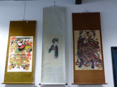 THREE CHINESE SCROLLS VARIOUSLY STENCILLED WITH A MAN WIELDING TWO SWORDS. 87.5 x 56.5cms. WITH A