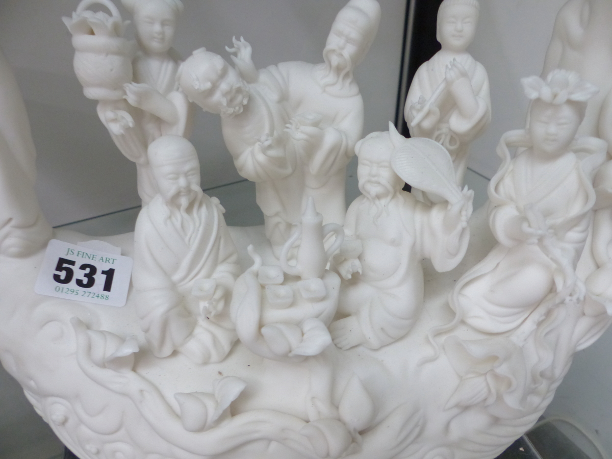 A CHINESE BISCUIT PORCELAIN TREE TRUNK SHIP BEARING THE EIGHT DAOIST IMMORTALS - Image 2 of 2