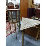 A TRIANGULAR OAK TABLE ON THREE SPINDLE LEGS TOGETHER WITH OCTAGONAL DISPLAY CABINET WITH GLAZED