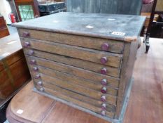 AN EIGHT DRAWER COLLECTORS CHEST.