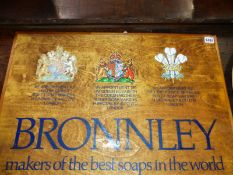 A VINTAGE BRONNLEY SOAP WOODEN ADVERTISING BOARD WITH ROYAL WARRANT.