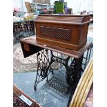 A SINGER TREADLE SEWING MACHINE.