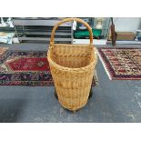 A BASKET WORK SHOPPING TROLLEY