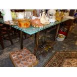 A VINTAGE/RETRO PLATE GLASS DINING TABLE