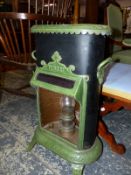 A PETROLUX CAST IRON ROOM HEATER.