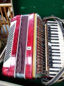 A VINTAGE PIANO ACCORDIAN AND CASE.