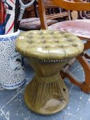 A BUTTON LEATHER UPHOLSTERED DRESSING STOOL.
