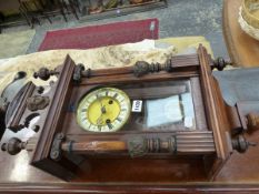 A SMALL VICTORIAN WALL CLOCK.