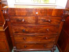 A VICTORIAN MAHOGANY CHEST OF TWO SHORT AND THREE GRADED LONG DRAWERS ON SPINDLE FEET. W 116 x D