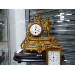 A GILT METAL AND ALABASTER MANTEL CLOCK TOGETHER WITH A CARRIAGE TIMEPIECE