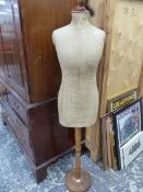 A VINTAGE DRESSMAKERS DUMMY.