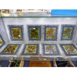 TEN LEADED GLASS PANELS DEPICTING FRUIT AND FLOWERS