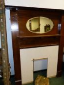 AN EDWARDIAN MAHOGANY FIRE SURROUND.