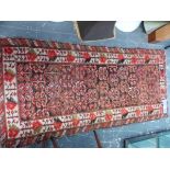 AN ANTIQUE PERSIAN TRIBAL RUG, 175 x 82cm TOGETHER WITH A BELOUCH PRAYER RUG (2)