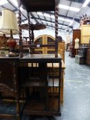 AN OAK REVOLVING BOOK CASE AND AN OAK OCCASIONAL TABLE.