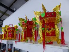 FOUR CHINESE DRSAGON DECORATED RED TEXTILE LANTERNS