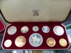 A 1953 CASED COIN SET, A MARSA RACE TRACK MALTA MEDALLION, AND VARIOUS £5 COINS.