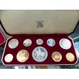 A 1953 CASED COIN SET, A MARSA RACE TRACK MALTA MEDALLION, AND VARIOUS £5 COINS.