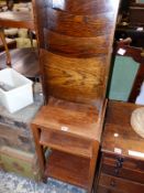 AN OAK MAGAZINE RACK AND A SMALL WALNUT THREE TIER TABLE.