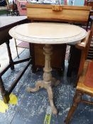 AN ANTIQUE LIME WASHED TRIPOD OCCASIONAL TABLE.