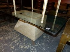 A GLASS TOPPED MODERNIST COFFEE TABLE.