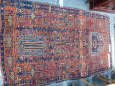 AN ANTIQUE PERSIAN TRIBAL RUG, 226 x 130cm