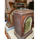TWO MAHOGANY CASED STRIKING MANTLE CLOCKS TOGETHER WITH A WALL CLOCK