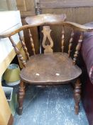 AN ANTIQUE CAPTAINS BOW BACK ARM CHAIR.