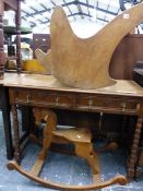 A RUSTIC ELM ROCKING CHAIR AND A WOODEN CARVED ROCKING HORSE.