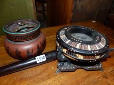 A VINTAGE MILITARY POLICE TRUNCHEON A QUILED AFRICAN BOWL ON STAND AND A TOBACCO JAR.