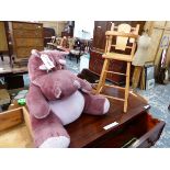 A PURPLE PLUSH HIPPO TEDDY AND A DOLLS HIGH CHAIR.