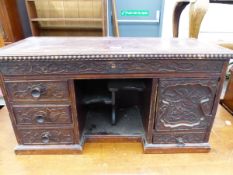 AN ORIENTAL HARD WOOD MINIATURE DESKTOP CABINET