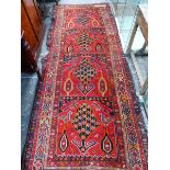 AN ANTIQUE CAUCASIAN RUNNER, 286 x 113cm