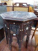 A MOORISH CARVED AND INLAID OCTAGONAL OCCASIONAL TABLE.