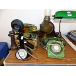 FOUR VARIOUS TELEPHONE SETS, A TABLE LAMP, AN OIL LAMP AND A CLOCK