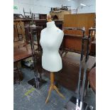 A PAIR OF CHROME CLOTHES RAILS AND A DRESS MAKERS DUMMY.