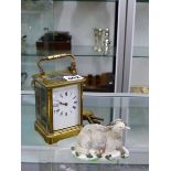 AN ANTIQUE STRIKING CARRIAGE CLOCK WITH KEY, TOGETHER WITH A SHEEP FIGURE.