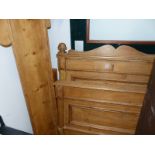 AN ANTIQUE PINE SINGLE SLEIGH BED WITH PANEL ENDS.