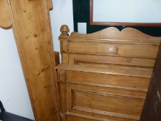 AN ANTIQUE PINE SINGLE SLEIGH BED WITH PANEL ENDS.