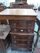 A MINIATURE CHEST OF FIVE DRAWERS AND A MAHOGANY WRITING SLOPE.