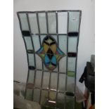 A LEADED GLASS PANEL.