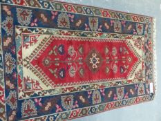 A TURKISH TRIBAL RUG, 208 x 120cm