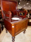 A VICTORIAN MAHOGANY ARMCHAIR COMMODE.