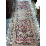 AN ANTIQUE PERSIAN HAMADAN RUNNER, 300 x 102cm